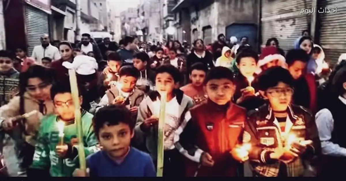 أهالي نقادة يحتفلون بعيد الغطاس بالشموع في الشوارع